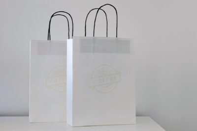 Wood fibre bag printed with bioink from coffee waste